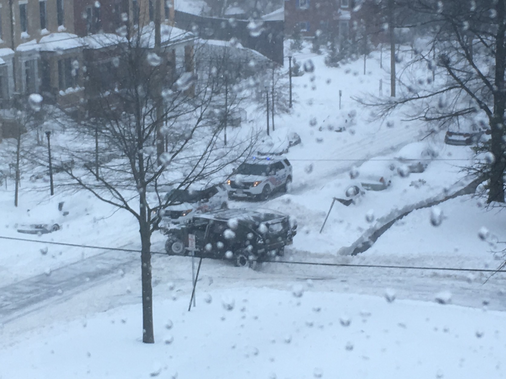 A National Guard vehicle gets stuck on the road in Northwest D.C. on Saturday. (WTOP/Keara Dowd)