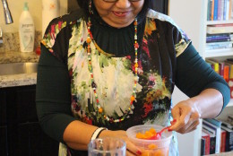 Jocelyn Law-Yone, or 'Chef JoJo', puts together a Mango Mogul falooda. (WTOP/Dana Gooley)