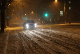 Cars drove slowly on Wisconsin Avenue as conditions worsened. (WTOP/Dana Gooley)