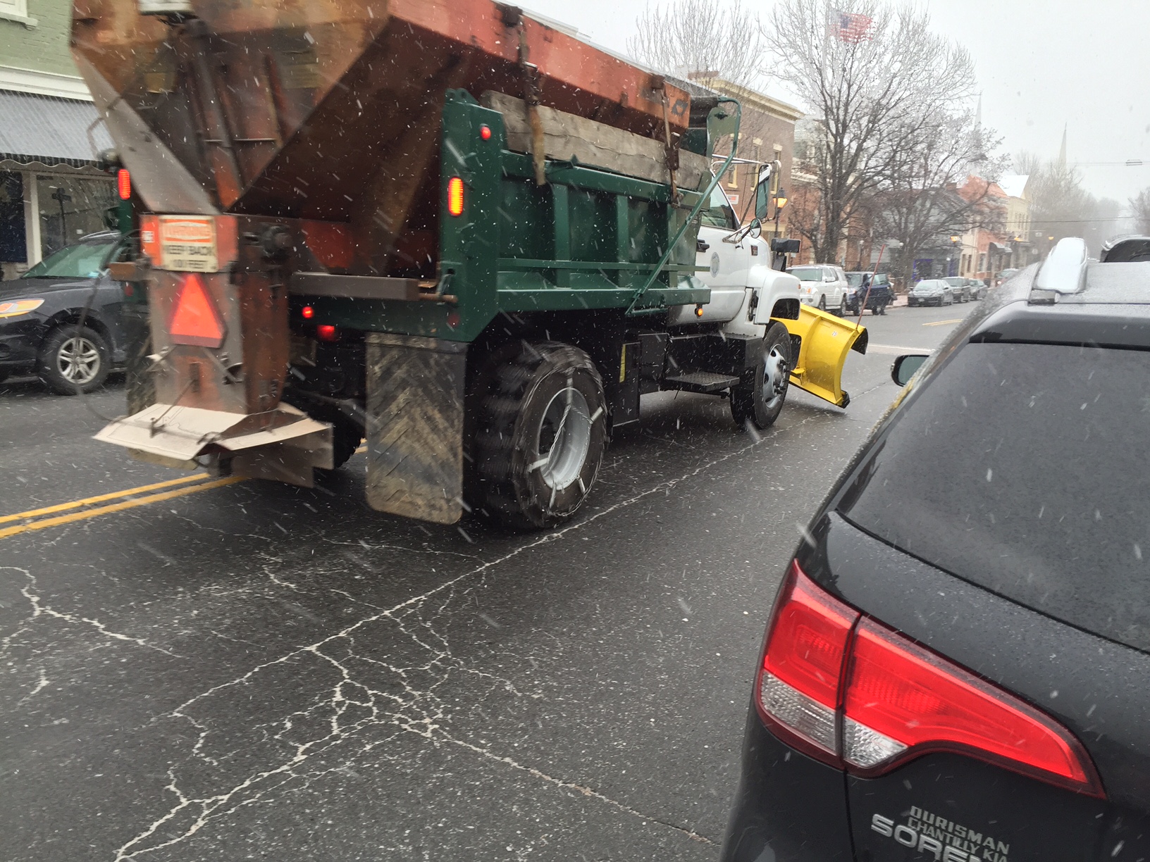 A snow plow heads down the road in Warrenton, Virginia on Friday, Jan. 22. (WTOP/Neal Augenstein)