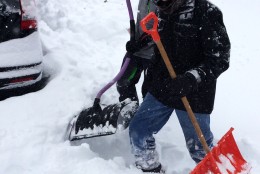 Kevin Hatcher and Aaron Bratt earn money shoveling out snow on Saturday, Jan. 23, 2016 (WTOP/Dick Uliano)