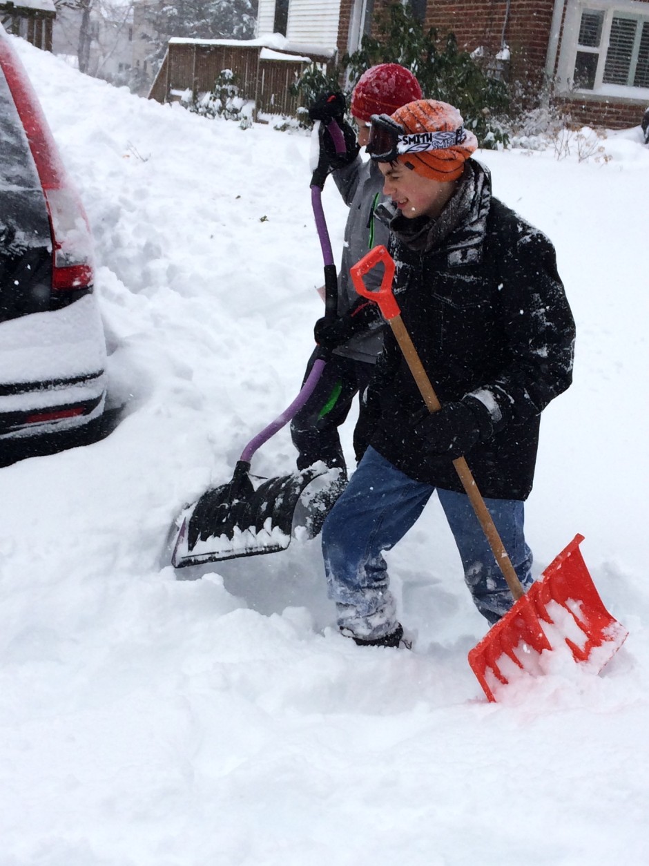 Kevin Hatcher and Aaron Bratt earn money shoveling out snow on Saturday, Jan. 23, 2016 (WTOP/Dick Uliano)