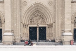A worker removes snow from the steps of Washington National Cathedral on Friday, Jan. 22, 2016 (From Twitter user Jen Burnett)
