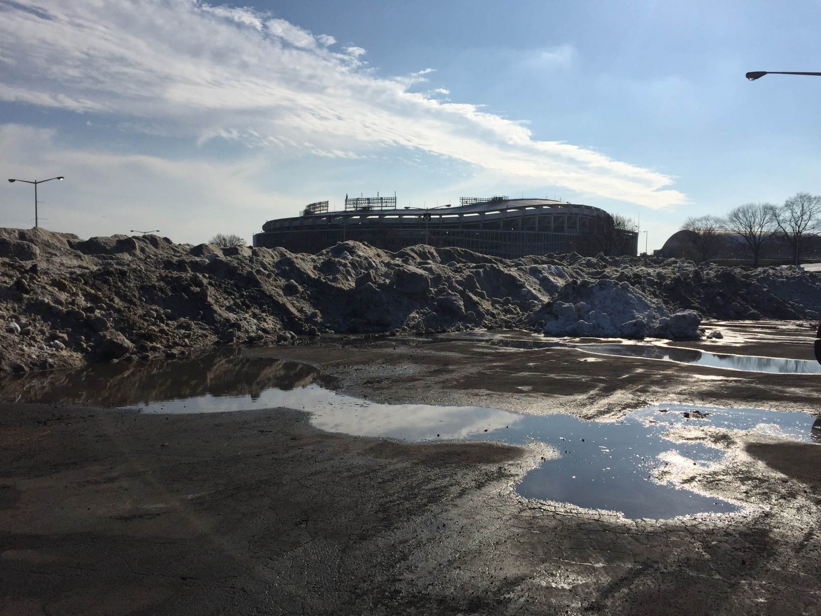 A view of RFK Stadium from snow-loaded Lot 7. The mountains of snow there are as much as 20 feet tall. (WTOP/Michelle Basch)