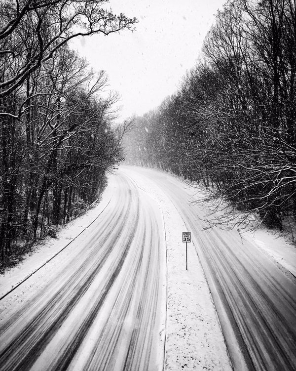 Snow accumulates on Wiehle Avenue in Reston, Va. on Friday, Jan. 22, 2016. (From Twitter user Robbie Nolan)