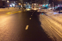 Snow is still taking up lanes on roads in the area, such as near the Silver Spring Transit Center. (WTOP/Nick Iannelli)