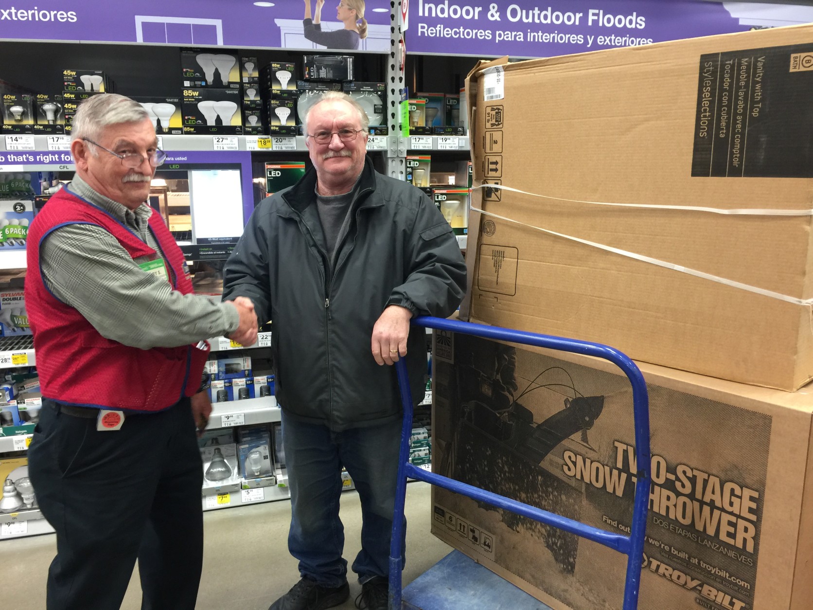 Bob Delong of Clifton, Va. will use this now thrower on his 200 foot driveway and to clear pasture areas for his horses. He and Lowe's Department Manager Larry Schultz have been friends for years.