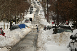 WASHINGTON, DC - JANUARY 26:  Narrow lanes have been carved down the middle of residential streets, burying cars and blocking crosswalks following the weekend blizzard January 26, 2016 in Washington, DC. The east coast is still digging out from Winter Storm Jonas that hit the East Coast over the weekend, breaking snowfall records, causing 29 storm-related deaths, and serious flooding in coastal areas.  (Photo by Chip Somodevilla/Getty Images)