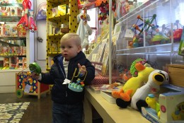 Charlie is 18 months old. His Parents Cyd and Mike Henry say they've been visiting the Why Not? shop for about 15 years. "It's just sad. Sad that times are changing," Mike says. (WTOP/Kristi King)