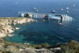 FILE - In this Jan. 14, 2012 file photo the luxury cruise ship Costa Concordia leans on its side after running aground in the tiny Tuscan island of Giglio, Italy. The captain of the shipwrecked Costa Concordia cruise ship Francesco Schettino was convicted Tuesday, May 31, 2016, of multiple charges of manslaughter and sentenced to 16 years in jail, Italian court officials said. (AP Photo/Gregorio Borgia, File)