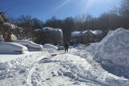 Mounds of snow are piled up in Germantown, Maryland as folks dig out.  (WTOP/Mike Jakaitis)