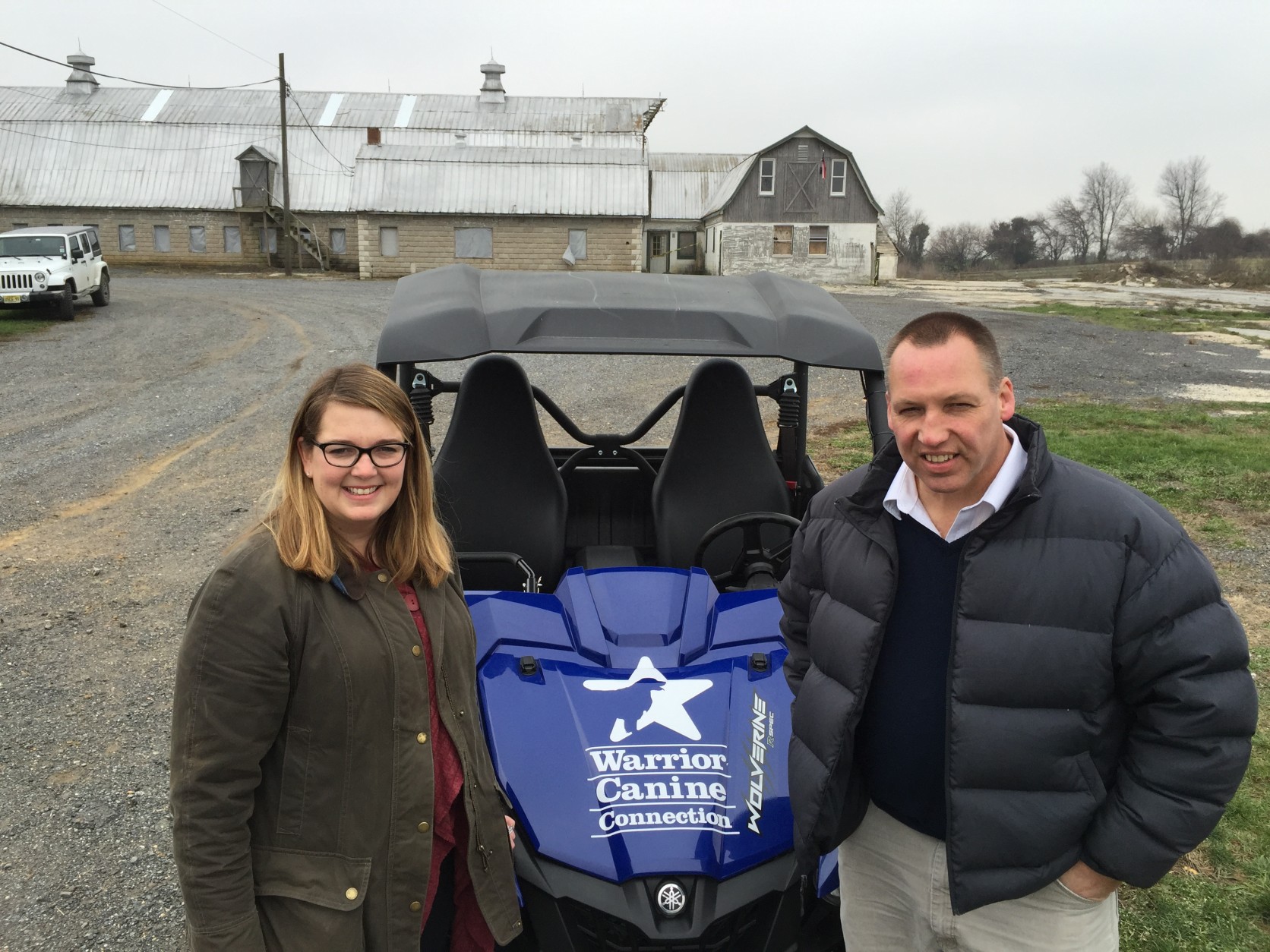 A deal with Maryland's Department of Natural Resources is allowing Warrior Canine Connection to renovate an old dairy farm for a training facility. Meredith Beck of the Bob Woodruff Foundation just handed over the keys to this UTV to WCC Executive Director Rick Yount. (WTOP/Kristi King)