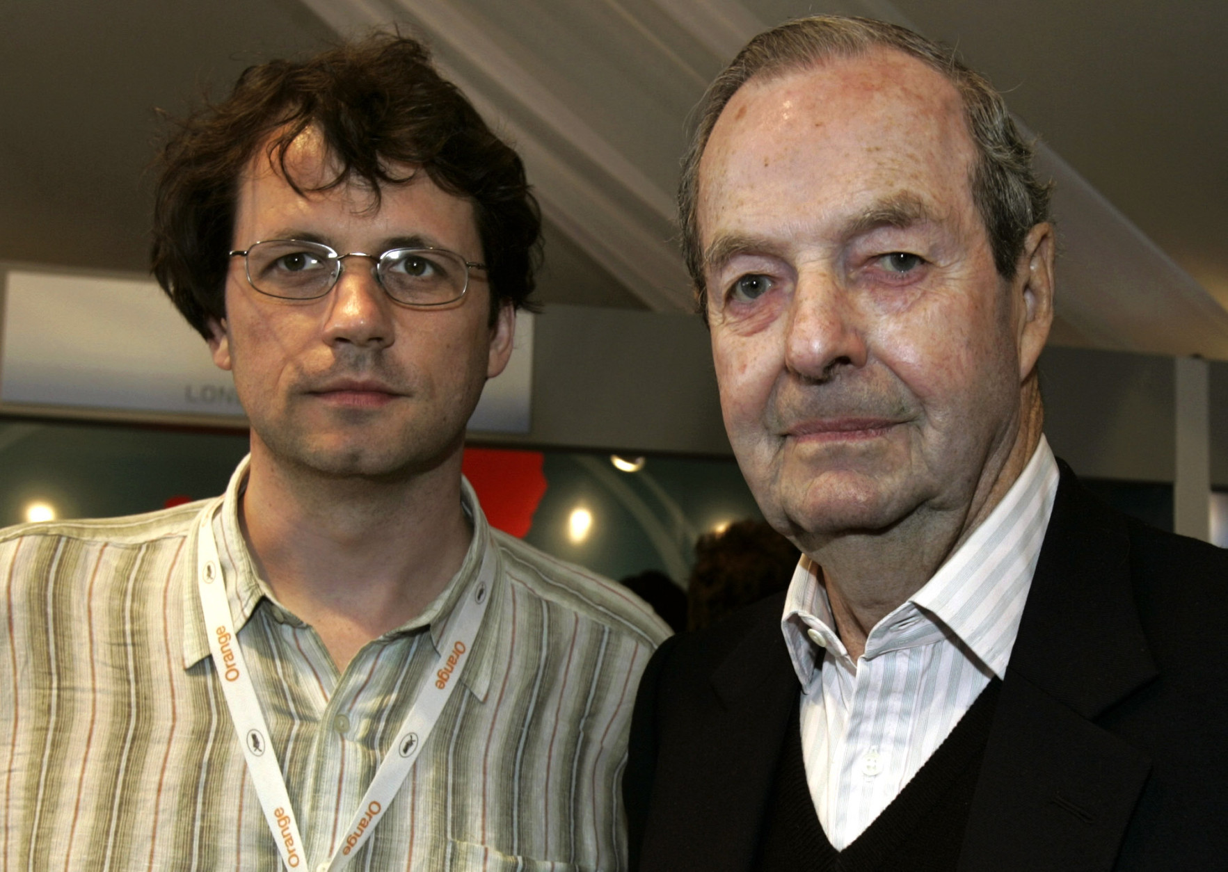 FILE In this file photo, dated Saturday May 14, 2005, Frederick Baker, the Anglo-Austrian director of "Shadowing The Third Man", left, and Britain's Guy Hamilton, director of four James Bond films, pose prior to their joint press conference at the 58th international Cannes film festival in Cannes, southern France. A hospital on his home island of Mallorca said he died aged 93 on Wednesday April 20, 2016. (AP Photo/Michel Euler, FILE)