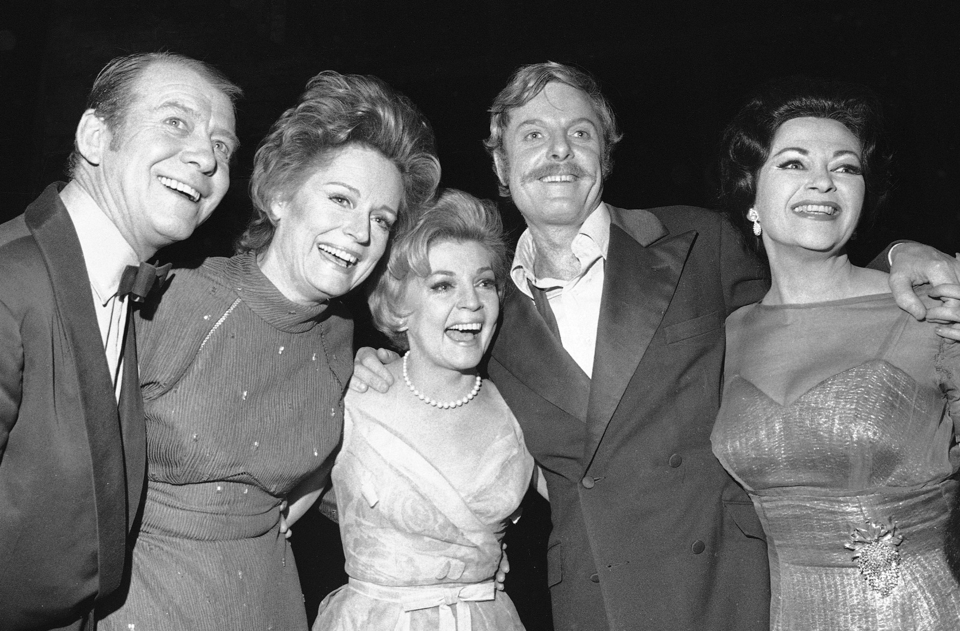 FILE - In this April 4, 1971 file photo, stars of the show "Follies," from left, Gene Nelson, Alexis Smith, Dorothy Collins, John McMartin, and Yvonne DeCarlo pose in New York. McMartin, the silver-haired, Tony Award-nominated actor whose Broadway career spanned decades, died of cancer, Wednesday, July 6, 2016, in New York. He was 86. (AP Photo/Ron Frehm, File)