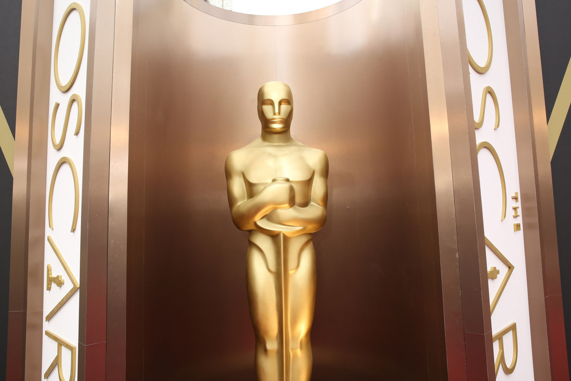 FILE - In this March 2, 2014 file photo, an Oscar statue appears at the Oscars at the Dolby Theatre in Los Angeles. Between Jan. 15, when Academy Award nominations are announced, and Feb. 22, film fans flock to the theaters to see the nominated works. On Feb. 21., AMC theaters will host 24-hour marathons for best-picture contenders in six busy movie markets around the country.  (Photo by Matt Sayles/Invision/AP, File)