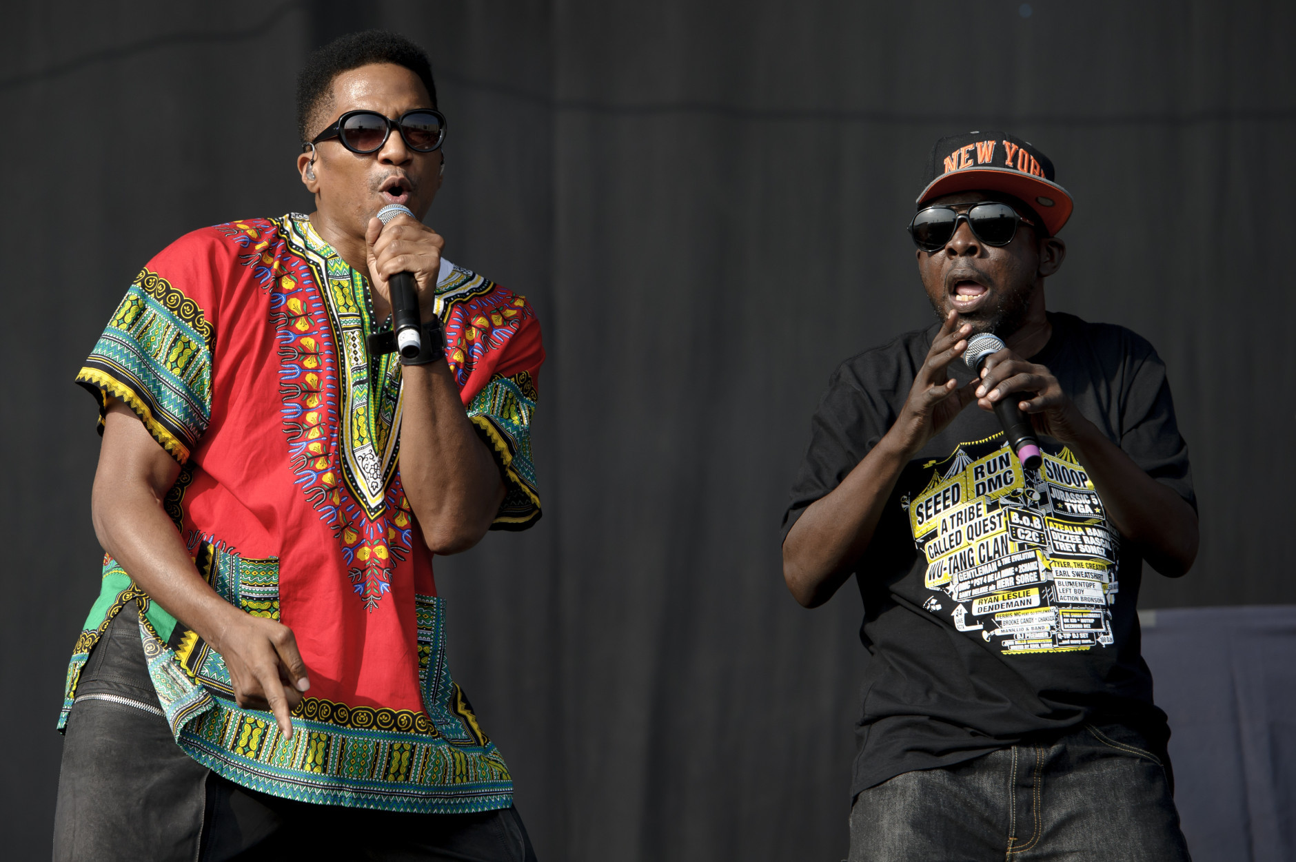 FILE - In this July 14, 2013 file photo, Q-Tip, left, and  Phife Dawg from U.S group A Tribe Called Quest performs on stage during the Wireless Festival at the Queen Elizabeth Olympic Park, in London. Dawg, a masterful lyricist whose witty wordplay was a linchpin of the groundbreaking hip-hop group, died Tuesday, March 22, 2016, from complications resulting from diabetes, his family said in a statement Wednesday. He was 45. (Photo by Jonathan Short/Invision/AP, File)