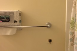 A bullet hole can be seen in Uzma Khan's bathroom. (WTOP/Dick Uliano)