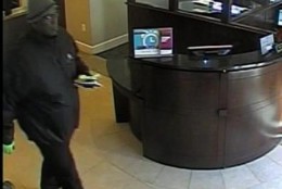 The FBI is searching for a man used a hoax bomb during a robbery at an Alexandria bank Monday.