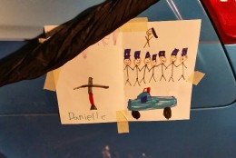 A child's picture remembering Ashley Guindon, who died responding to a situation involving Ronald Hamilton in Woodbridge, Virginia. (WTOP/Kathy Stewart)