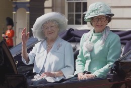 Britain's Queen Mother, left, and her youngest daughter Princess Margaret, sit in an open top horse drawn carriage as they leave Buckingham Palace, in central London, for the short ride to Horse Guards parade, where senior members of the Royal family gather for the annual Trooping the Colour ceremony, Saturday, June 17, 2000.  Queen Elizabeth II will take the salute at the military parade on London's Horse Guards, marking the sovereign's official birthday. (AP Photo/Alban Donohoe, Pool)