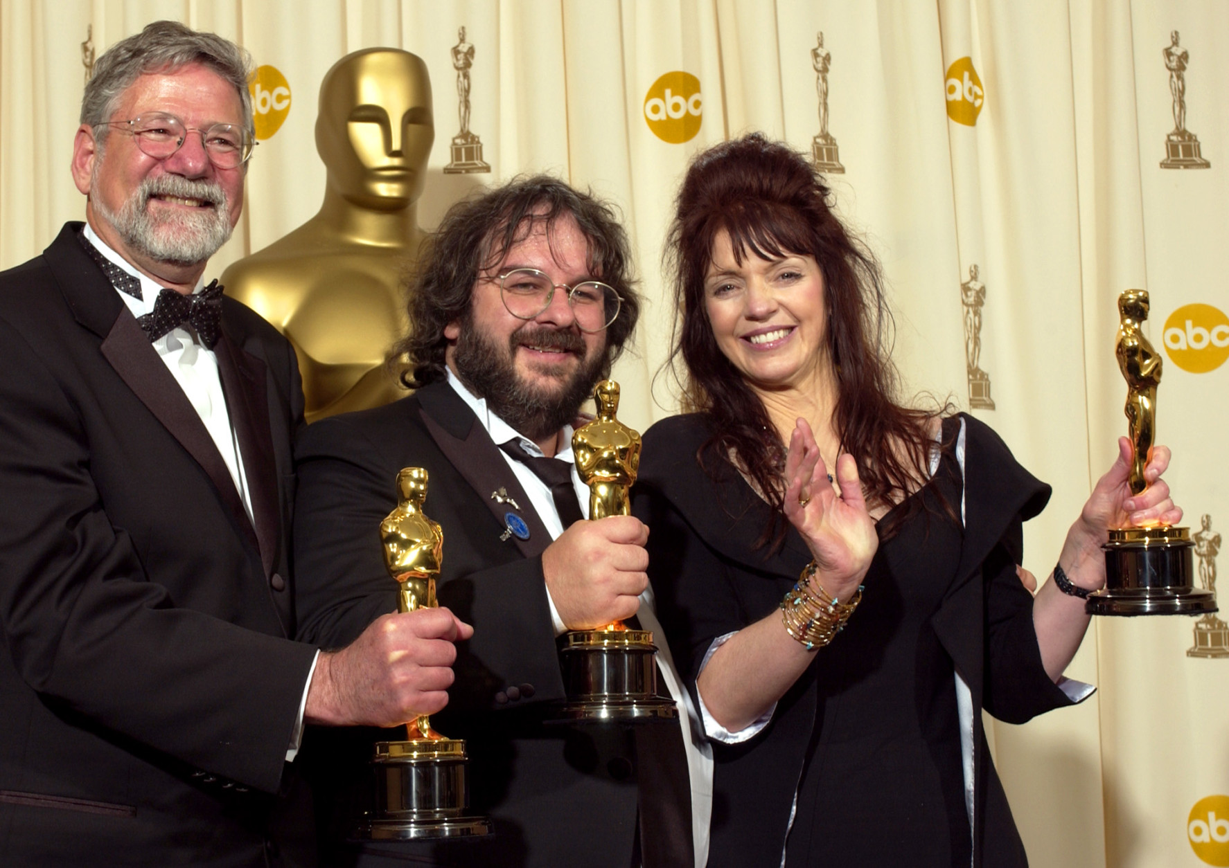 From left, producers Barrie M. Osborne, Peter Jackson and Fran Walsh pose with their Oscars after the film The Lord of the Rings: The Return of the King won for best motion picture of the year at the 76th annual Academy Awards Sunday, Feb. 29, 2004, in Los Angeles. (AP Photo/Reed Saxon)