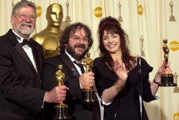 From left, producers Barrie M. Osborne, Peter Jackson and Fran Walsh pose with their Oscars after the film The Lord of the Rings: The Return of the King won for best motion picture of the year at the 76th annual Academy Awards Sunday, Feb. 29, 2004, in Los Angeles. (AP Photo/Reed Saxon)
