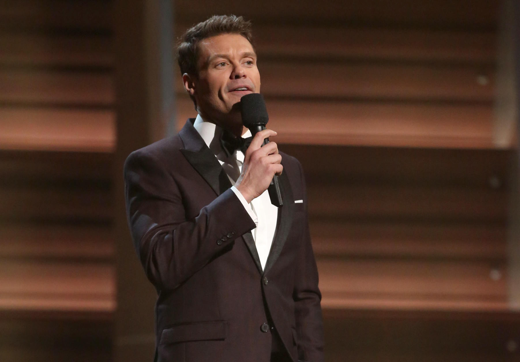 Ryan Seacrest introduces a performance by Little Big Town at the 58th annual Grammy Awards on Monday, Feb. 15, 2016, in Los Angeles. (Photo by Matt Sayles/Invision/AP)