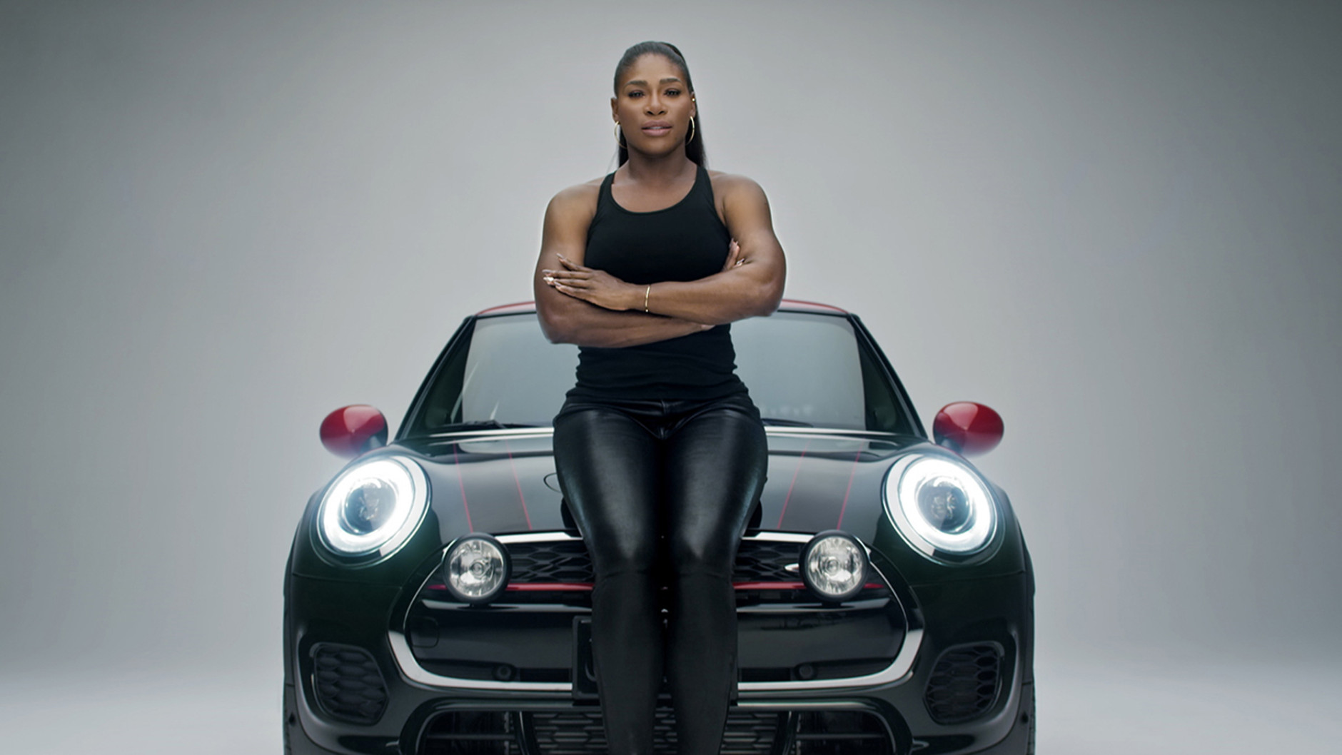 This image provided by Mini USA shows a still from the company's Super Bowl 50 "Defy Labels" ad spot featuring tennis star Serena Williams. Williams is one of several celebrities being featured in Mini USA's Super Bowl spot. (Mini USA via AP)