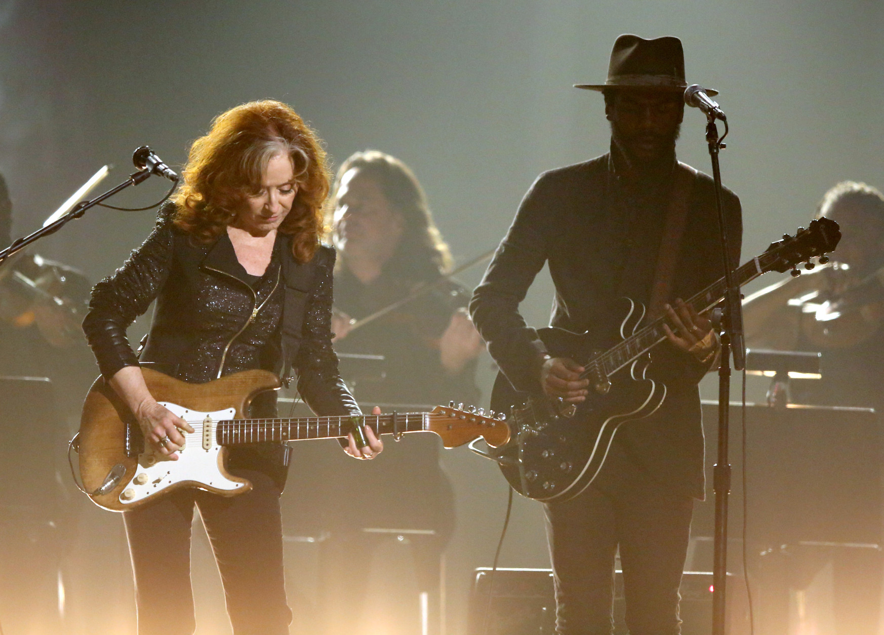 Bonnie Raitt, left, and Gary Clark Jr. perform a tribute to B.B. King at the 58th annual Grammy Awards on Monday, Feb. 15, 2016, in Los Angeles. (Photo by Matt Sayles/Invision/AP)