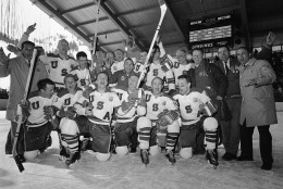 A happy band of American hockey players lets go a yell at the end of Olympic hockey game against Czechoslovakia in which the U.S. players captured a gold medal with a 9-4 victory, Feb. 28, 1960, Squaw Valley, Calif. The players are unidentified. (AP Photo)