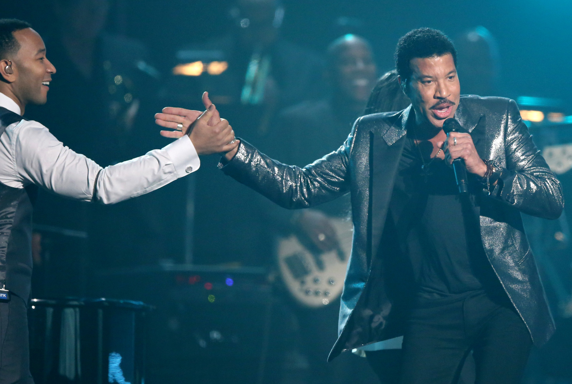 John Legend, left, and Lionel Richie perform during a tribute in his honor at the 58th annual Grammy Awards on Monday, Feb. 15, 2016, in Los Angeles. (Photo by Matt Sayles/Invision/AP)