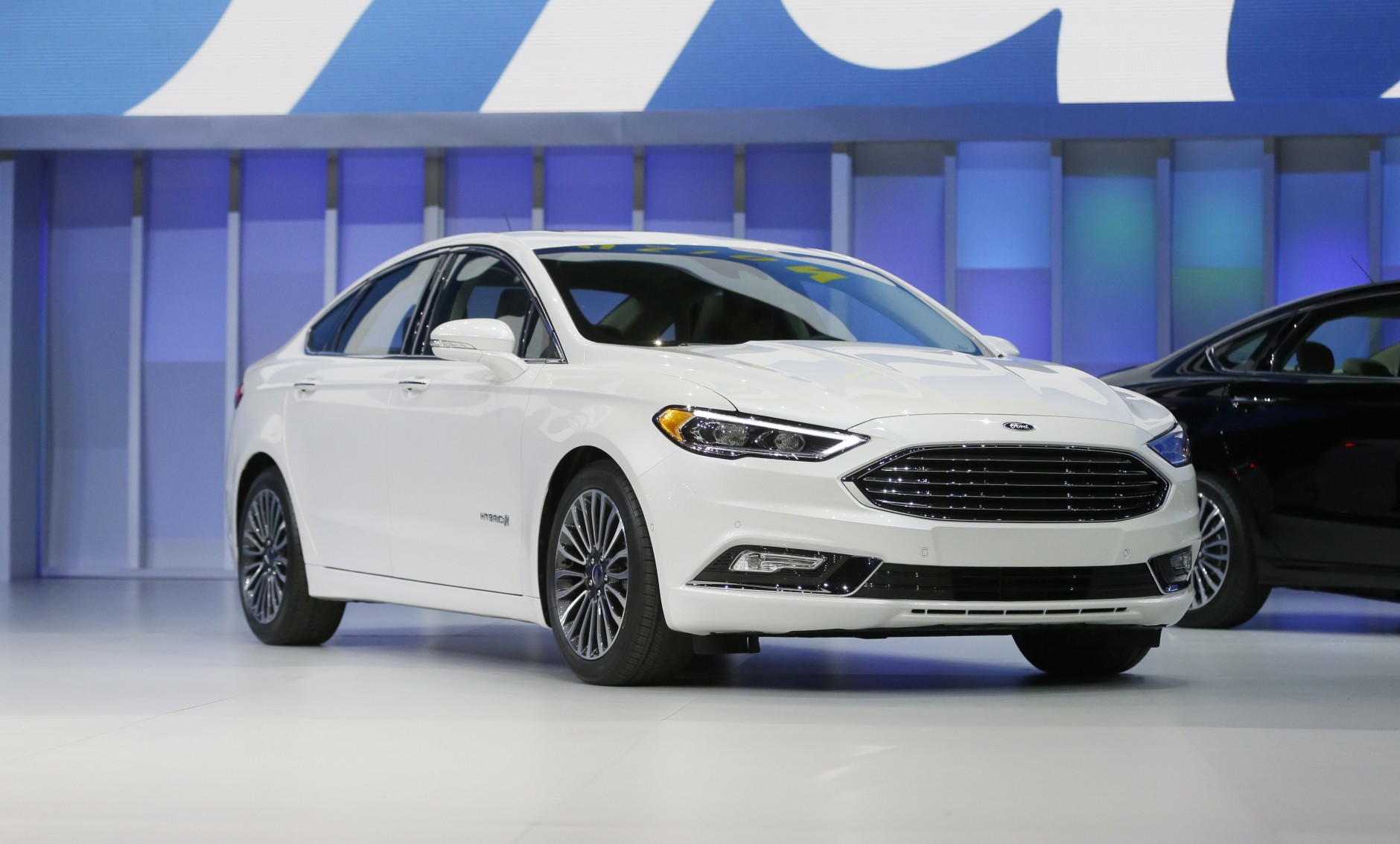 The Ford Fusion hybrid is displayed at the North American International Auto Show, Monday, Jan. 11, 2016, in Detroit. (AP Photo/Carlos Osorio)