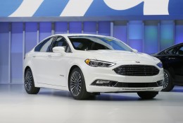 The Ford Fusion hybrid is displayed at the North American International Auto Show, Monday, Jan. 11, 2016, in Detroit. (AP Photo/Carlos Osorio)