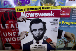 FILE - In this Thursday, Oct. 18, 2012, file photo, a copy of Newsweek is seen at Joe's Smoke, in Portland, Maine. Paper copies of Newsweek will again roll off the presses starting in 2014. Editor-in-Chief Jim Impoco says the news magazines owners IBT Media want to shift to a business model where a weekly print magazine would be mainly supported by subscription fees instead of advertising.  (AP Photo/Robert F. Bukaty, File)