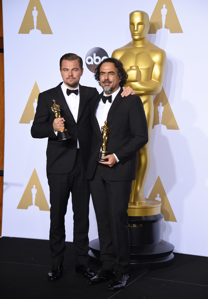 Leonardo DiCaprio, winner of the award for best actor in a leading role for The Revenant, left, and Alejandro G. Inarritu, winner of the award for best director for The Revenant, pose in the press room with their awards at the Oscars on Sunday, Feb. 28, 2016, at the Dolby Theatre in Los Angeles. (Photo by Jordan Strauss/Invision/AP)