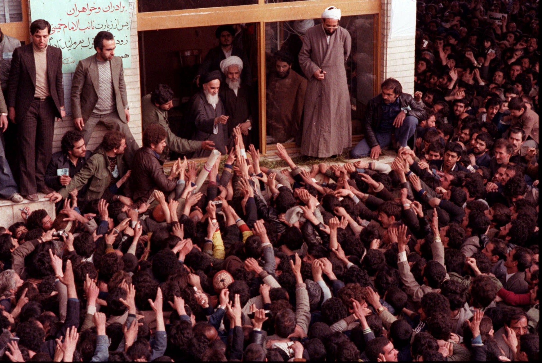 The late Ayatollah Ruhollah Khomeini, center, is greeted by supporters after arriving at the airport in Tehran Iran in this Feb. 1, 1979 photo. Monday Feb. 1, 1999 is the 20th anniversary of Khomeini's return from exile to lead the Islamic revolution in his country.  ( AP Photo )