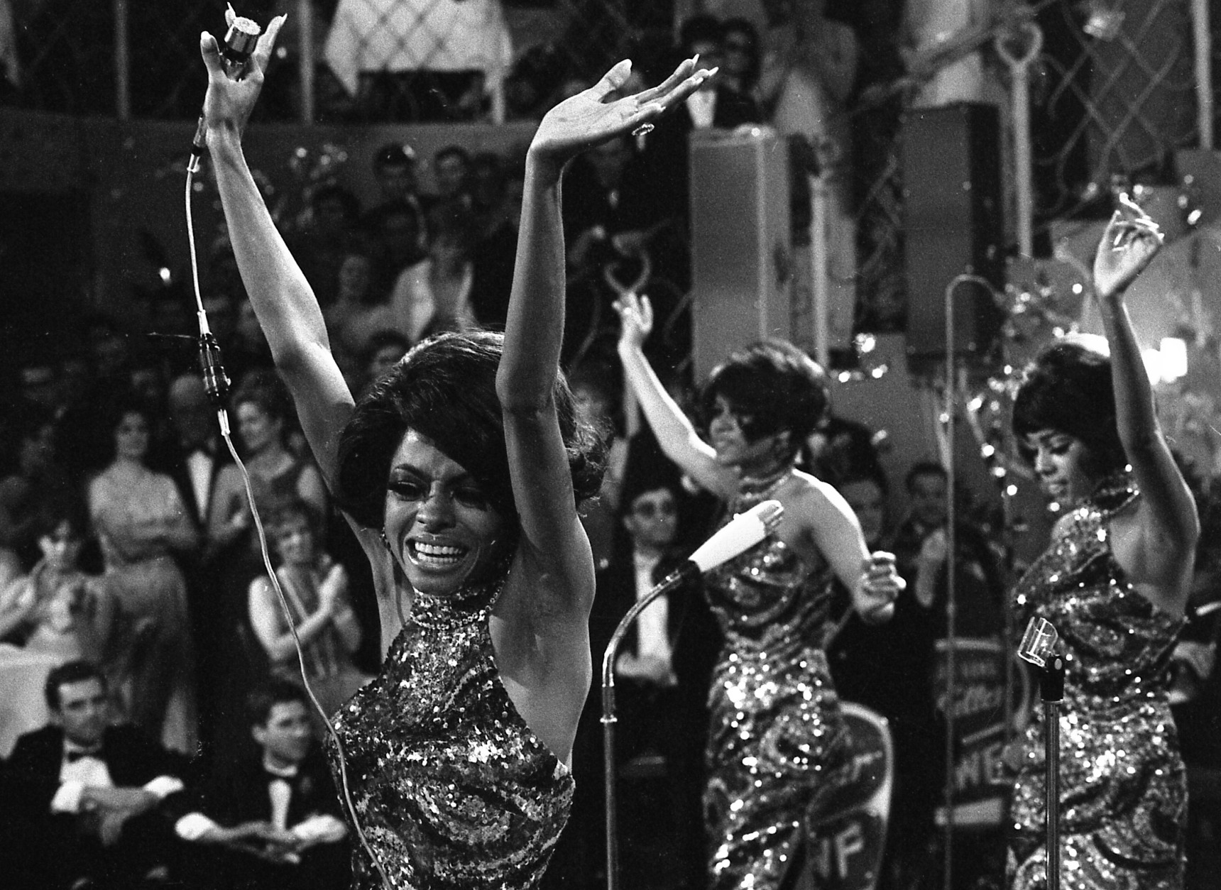 FILE -In this Jan. 21, 1968 file photo, The Supremes with Diana Ross, front, Cindy Birdsong and Mary Wilson dance with their arms in the air as they perform at the annual "Bal pare" party in Munich, West Germany. Ross, Wilson and the Florence Ballard made up the first successful configuration of the group. Cindy Birdsong replaced Ballard in 1967. Wilson, now 70, reminisced in an interview with Associated Press on June 12, 2014, about a major milestone: the 50th anniversary of the Supremes first No. 1, million-selling song, Where Did Our Love Go - released June 17, 1964.  (AP Photo/Frings, file)