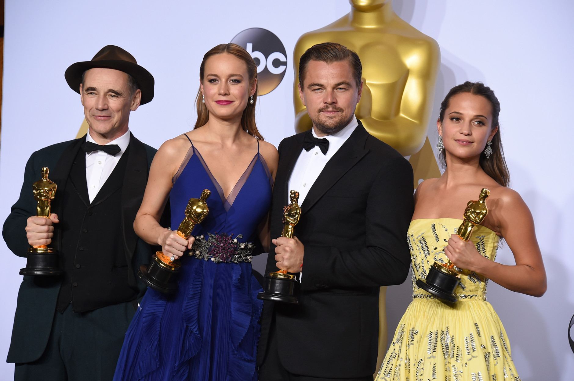 Mark Rylance, winner of the award for best actor in a supporting role for Bridge of Spies,"  from left, Brie Larson, winner of the award for best actress in a leading role for Room, Leonardo DiCaprio, winner of the award for best actor in a leading role for The Revenant, and Alicia Vikander, winner of the award for best actress in a supporting role for The Danish Girl pose in the press room at the Oscars on Sunday, Feb. 28, 2016, at the Dolby Theatre in Los Angeles. (Photo by Jordan Strauss/Invision/AP)