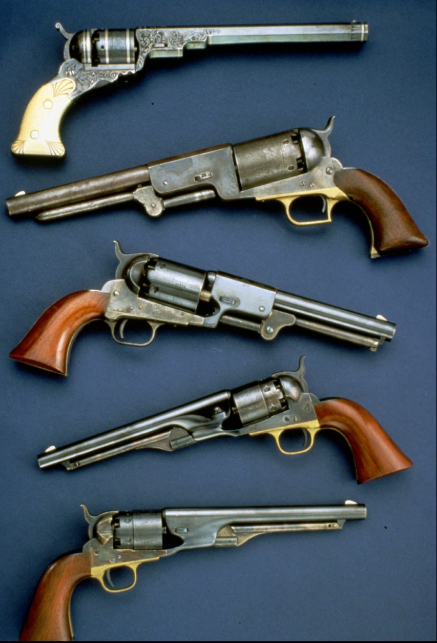 FILE-- These handguns reflect the evolution of Samuel Colt's revolver. Colt's invention was the first practical revolving firearm. The Wadsworth Atheneum in Hartford, Conn., is opening an exhibition titled "Sam and Elizabeth: Legend and Legacy of the Colt Empire," Sunday, Sept. 8 , 1996.  (AP Photo/File)