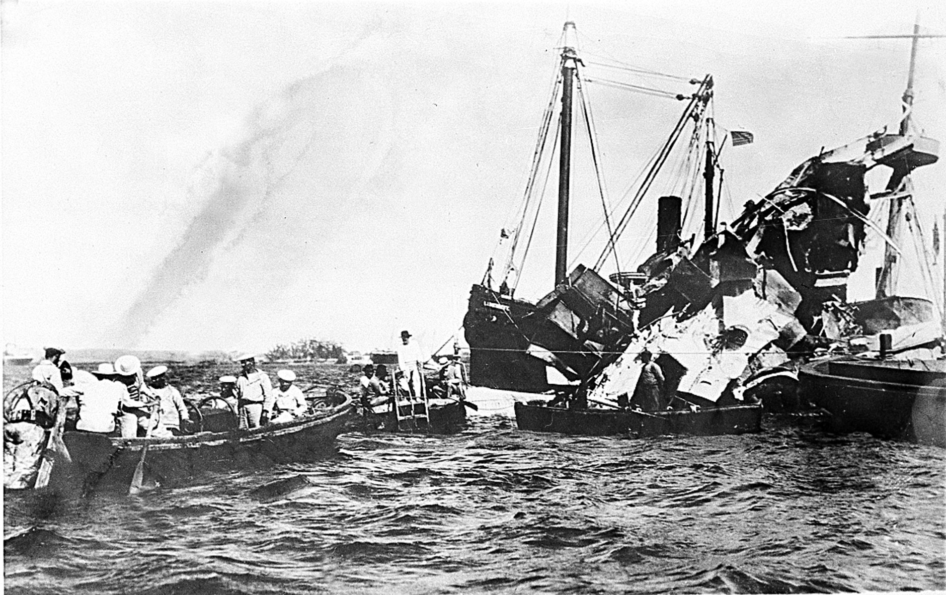 Lifeboats rescue surviving crewmen of the wrecked USS Maine after an underground explosion destroyed the battleship on the night of Feb. 15 as it was anchored in the Havana harbor, Cuba, in 1898.  About 260 U.S. Naval personnel were killed in the explosion.  The sinking of the U.S. warship was a catalyst for the outbreak of the Spanish-American War and the U.S. officially waged war on April 25.  (AP Photo)