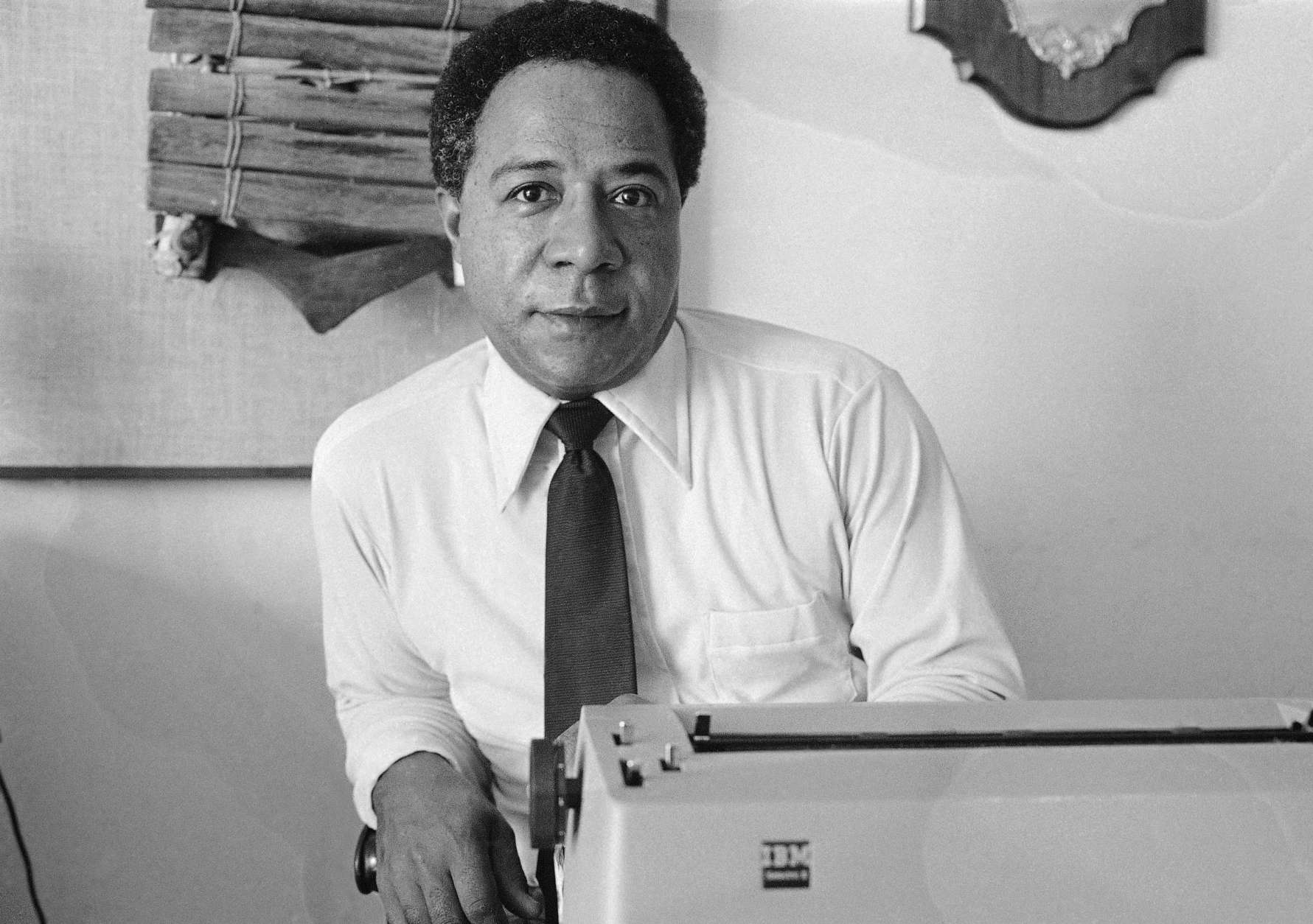 FILE - In this May 16, 1974, file photo, writer Alex Haley, a West Tennessee native who traced his family back to Africa is pictured in his San Francisco apartment. Under proposed changes to Tennessee’s social studies curriculum, public school students would no longer be required to be taught about Haley and the impact of his Pulitzer-prize winning book “Roots: The Saga of an American Family.” (AP Photo/File)