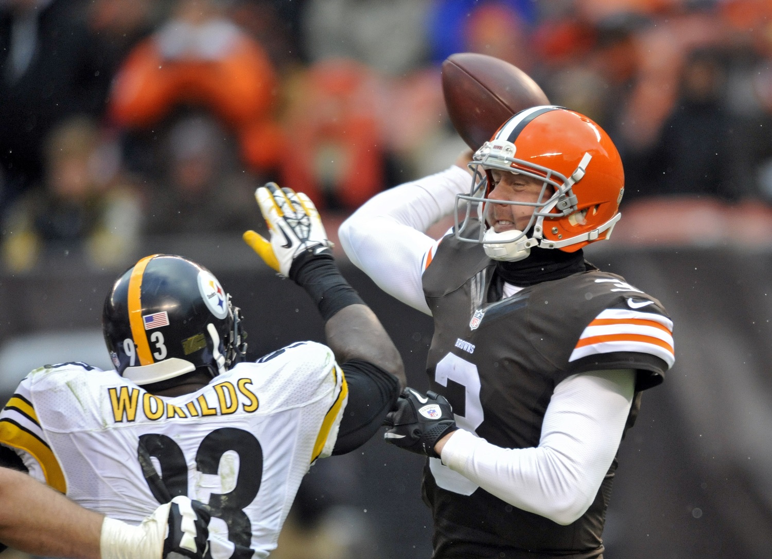 Cleveland Browns quarterback Brandon Weeden throws incomplete under pressure from Pittsburgh Steelers linebacker Jason Worilds in the fourth quarter of an NFL football game Sunday, Nov. 24, 2013. (AP Photo/David Richard)