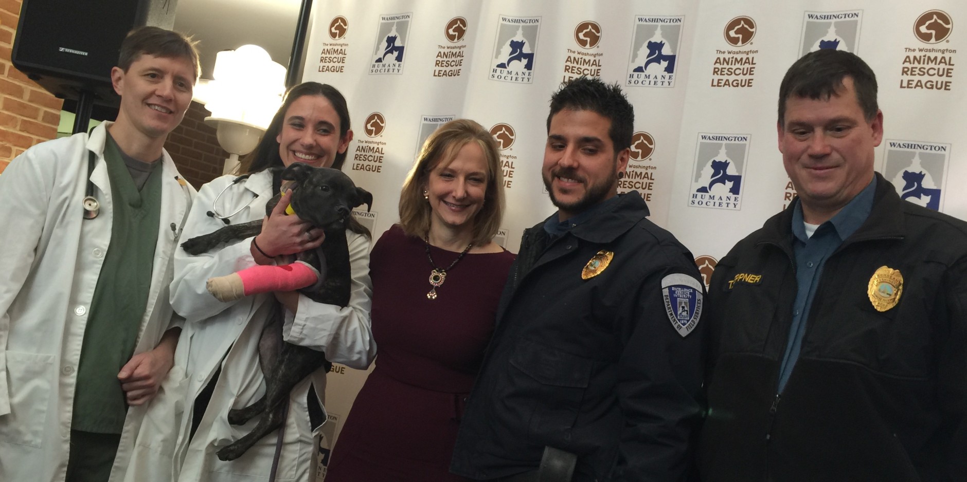 Now the cops and docs work for the same group. Vets Daniel Shillito and Megan McAndrew, formerly of WARL, the new group's CEO Lisa LaFontaine and officers Ted Deppner and Dan D'Eramo formerly of WHS with Daisy, the new group's inaugural animal transfer. (WTOP/Kristi King)
