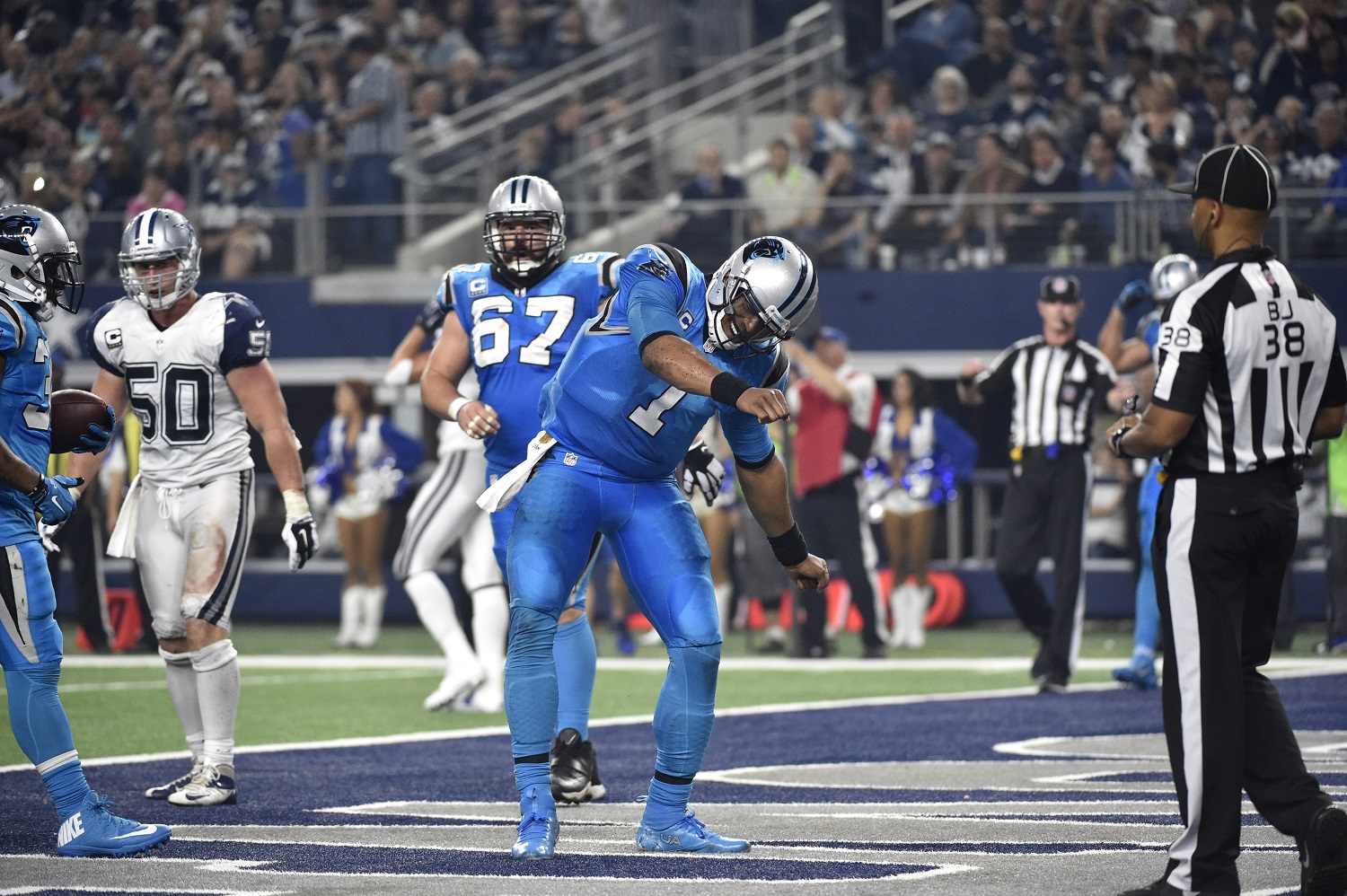 Carolina Panthers quarterback Cam Newton (1) dances in the end zone after rushing for a touchdown against the Dallas Cowboys during an NFL football game, Thursday, Nov. 26, 2015, in Arlington, Texas. (AP Photo/Michael Ainsworth)