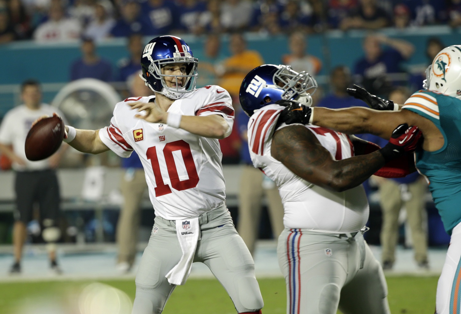 New York Giants quarterback Eli Manning (10) looks to pass during the first half of an NFL football game against the Miami Dolphins, Monday, Dec. 14, 2015, in Miami Gardens, Fla.  (AP Photo/Wilfredo Lee)