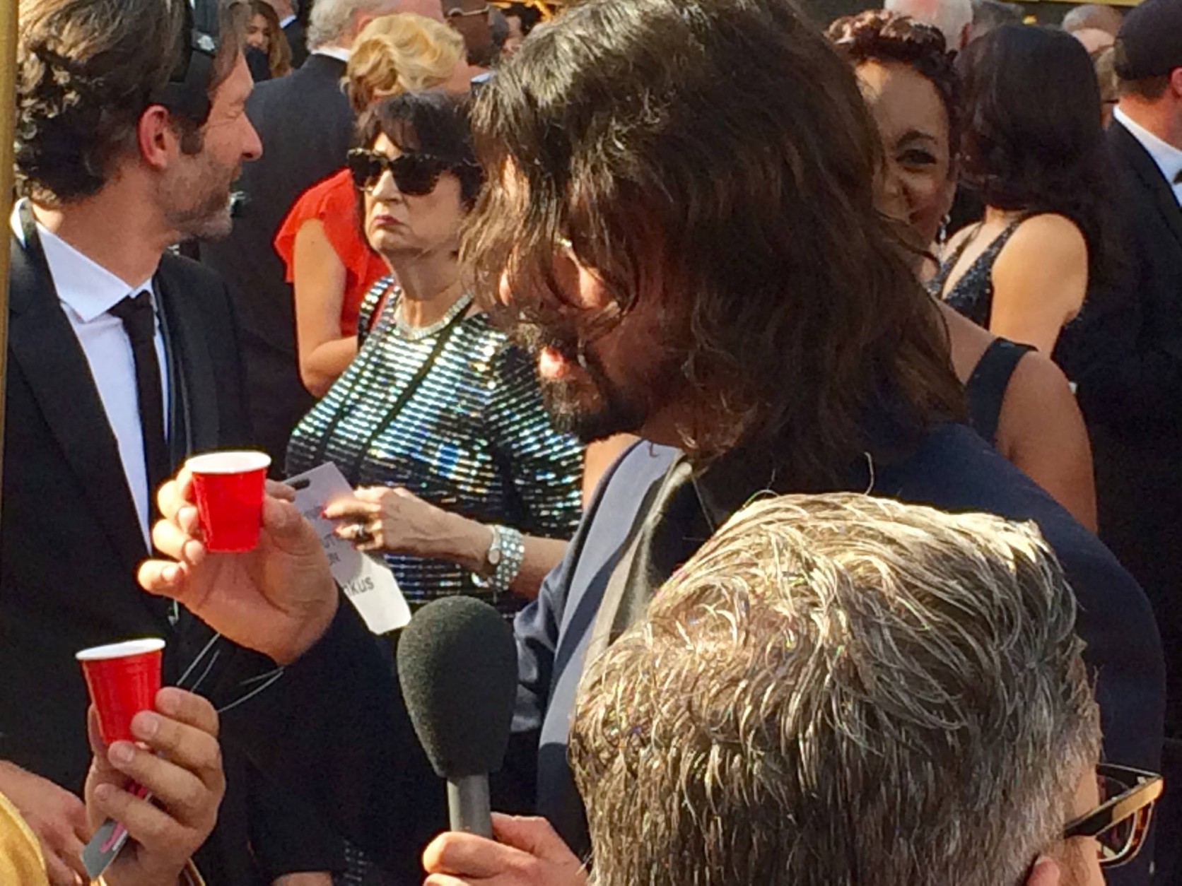D.C.-area native Dave Grohl does shots on the red carpet. (WTOP/Jason Fraley)