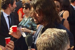 D.C.-area native Dave Grohl does shots on the red carpet. (WTOP/Jason Fraley)