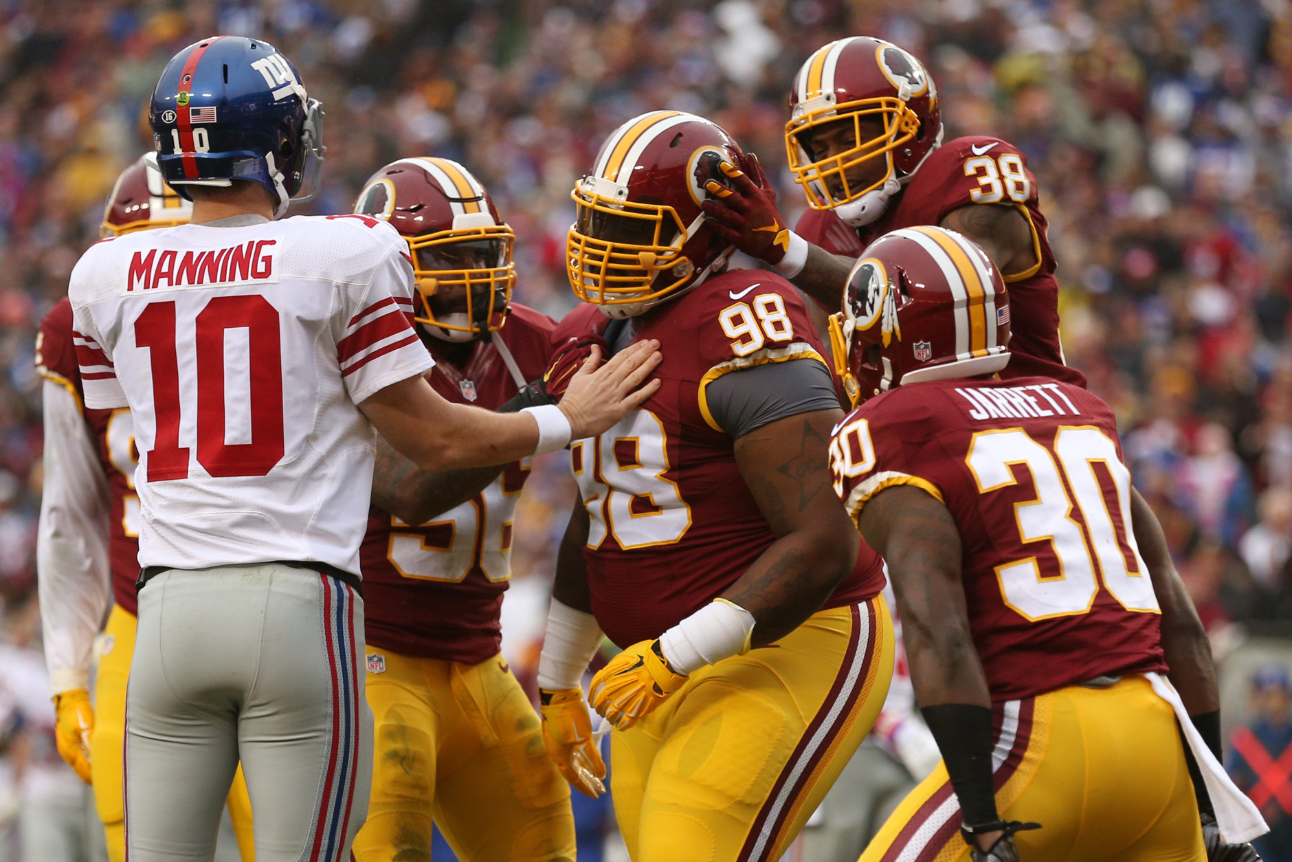 LANDOVER, MD - NOVEMBER 29: Defensive tackle Terrance Knighton #98, free safety Dashon Goldson #38 strong safety Kyshoen Jarrett #30 of the Washington Redskins react after a play while quarterback Eli Manning #10 of the New York Giants looks on in the first quarter at FedExField on November 29, 2015 in Landover, Maryland. (Photo by Patrick Smith/Getty Images)