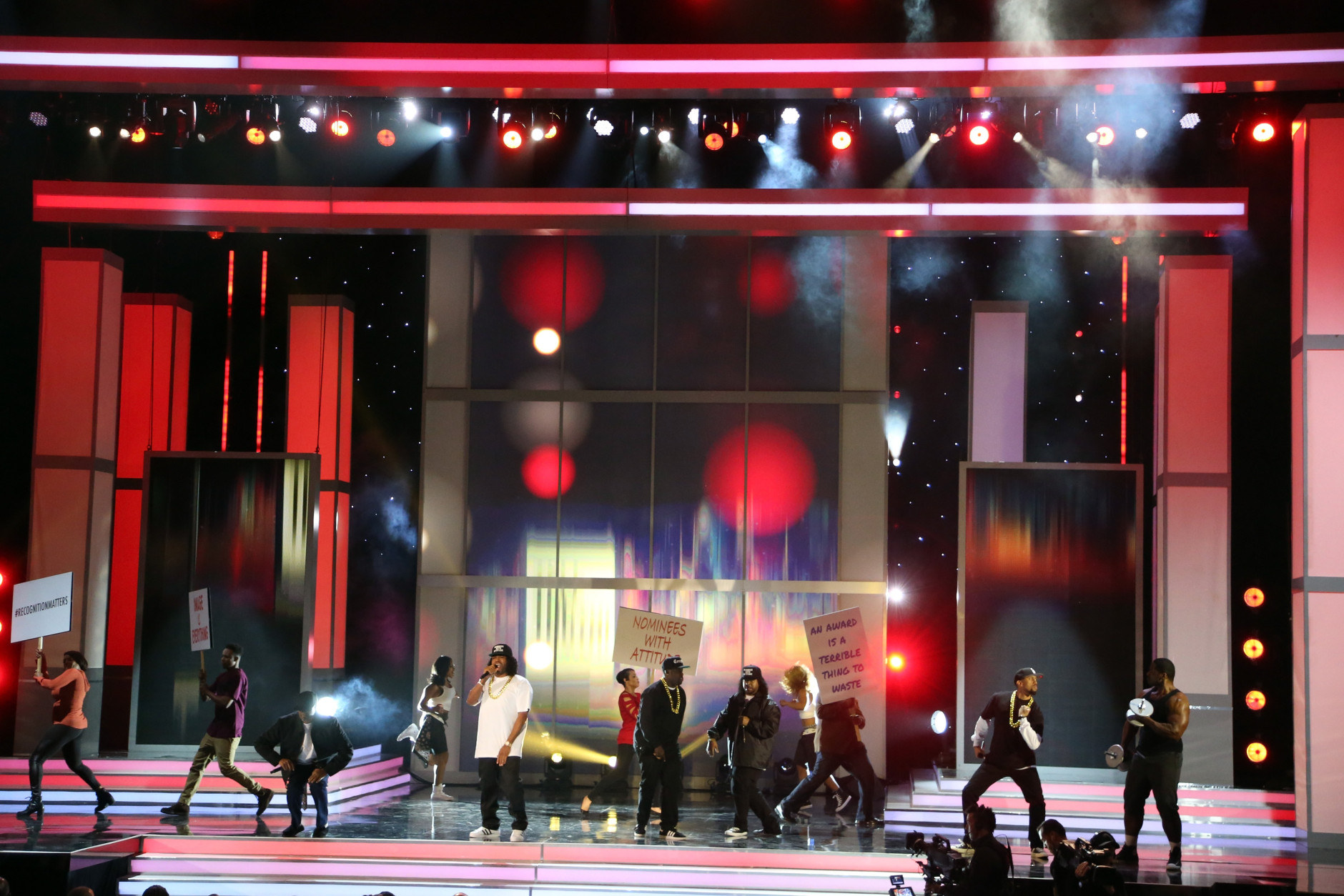 PASADENA, CA - FEBRUARY 05:  Host Anthony Anderson (C) raps onstage during the 47th NAACP Image Awards presented by TV One at Pasadena Civic Auditorium on February 5, 2016 in Pasadena, California.  (Photo by Frederick M. Brown/Getty Images for NAACP Image Awards)