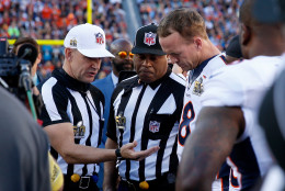 SANTA CLARA, CA - FEBRUARY 07:  Referee Clete Blakeman looks at the coin with  Peyton Manning #18 of the Denver Broncos prior to playing the Carolina Panthers in Super Bowl 50 at Levi's Stadium on February 7, 2016 in Santa Clara, California.  (Photo by Ezra Shaw/Getty Images)